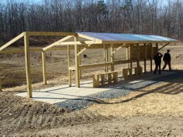 Pistol competitor engaging steel targets