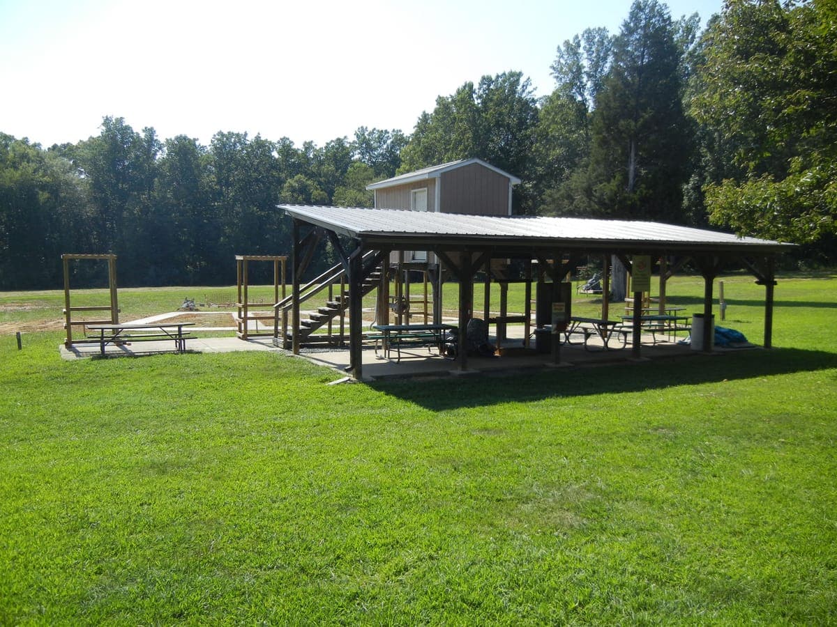 Skeet range clay target in flight over the field